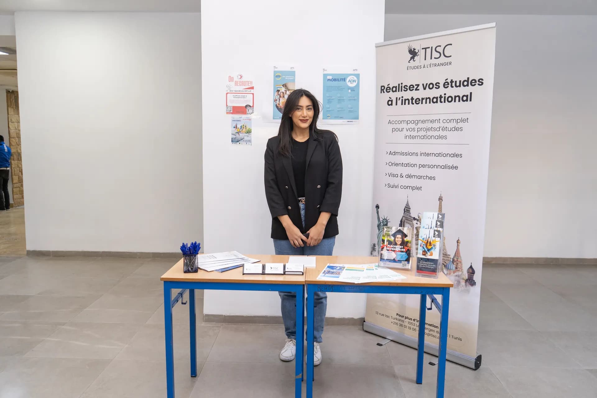 TISC booth with a roll-up banner promoting international studies