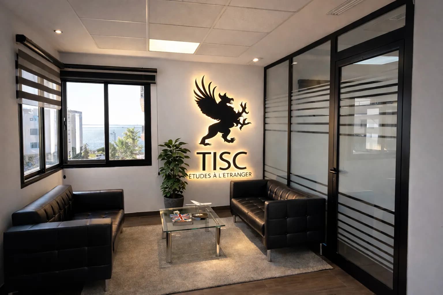 TISC reception area with the backlit logo on the wall