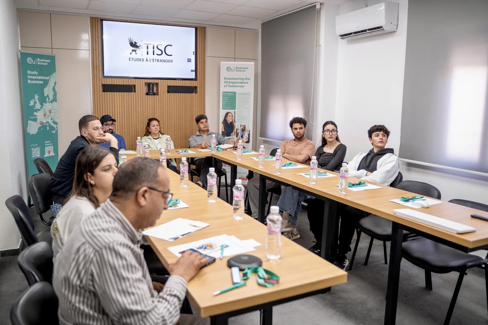 TISC seminar in a conference room with a group of students