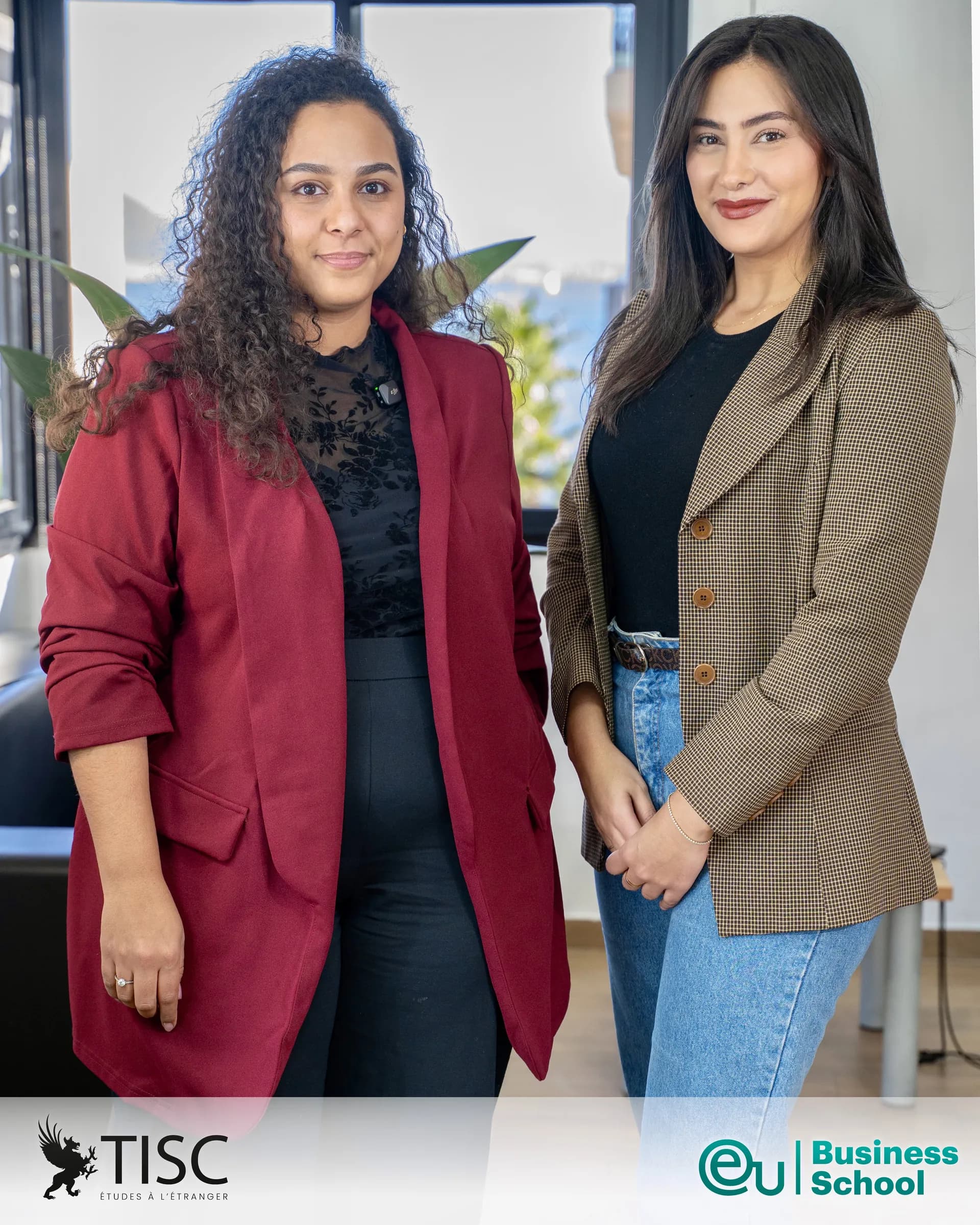 Two TISC team members with the TISC and EU Business School logos